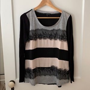 Long sleeve lace trim tee shirt.